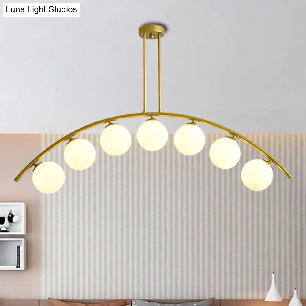Modern gold island pendant with clear white shade for kitchens