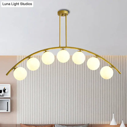 Modern gold island pendant with clear white shade for kitchens