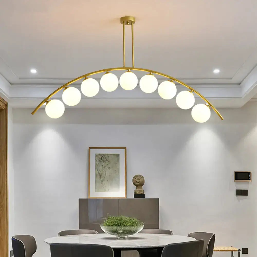 Modern gold island pendant with clear white shade for kitchens