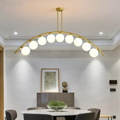 Modern gold island pendant with clear white shade for kitchens