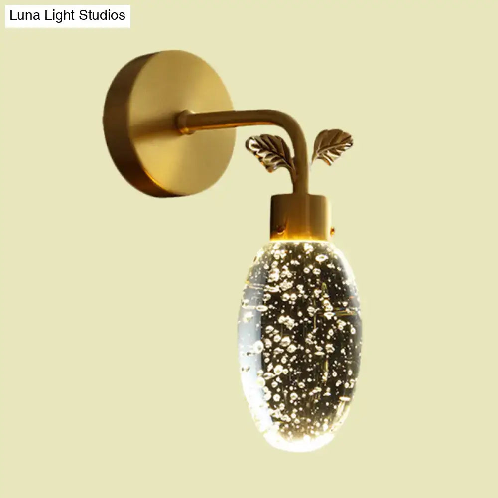 Modern gold leaf led wall sconce with seeded crystal globe bedroom