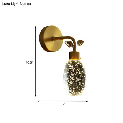 Modern gold leaf led wall sconce with seeded crystal globe bedroom