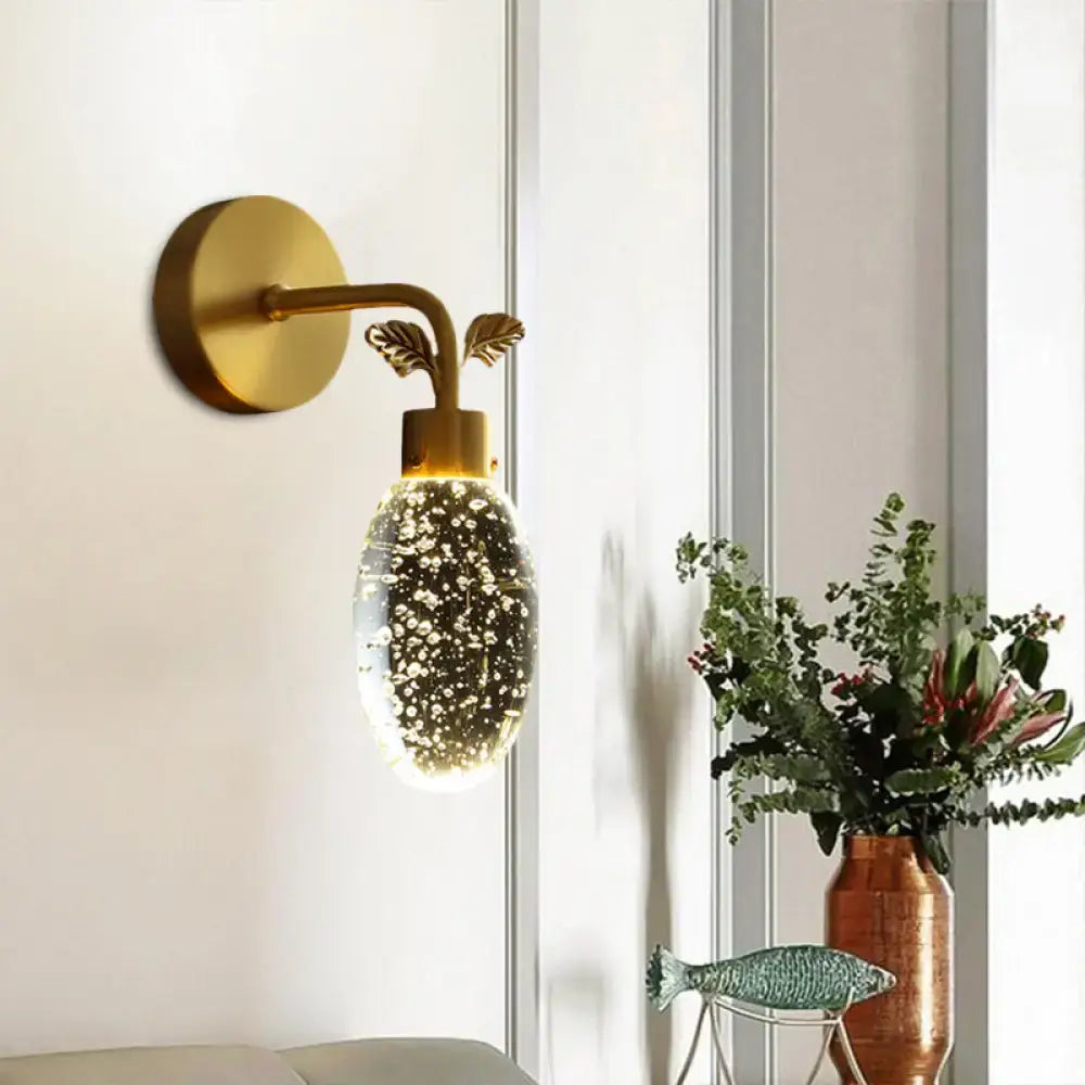 Modern gold leaf led wall sconce with seeded crystal globe bedroom