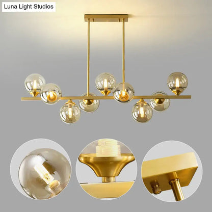 Modern gold metal amber glass island light for dining room