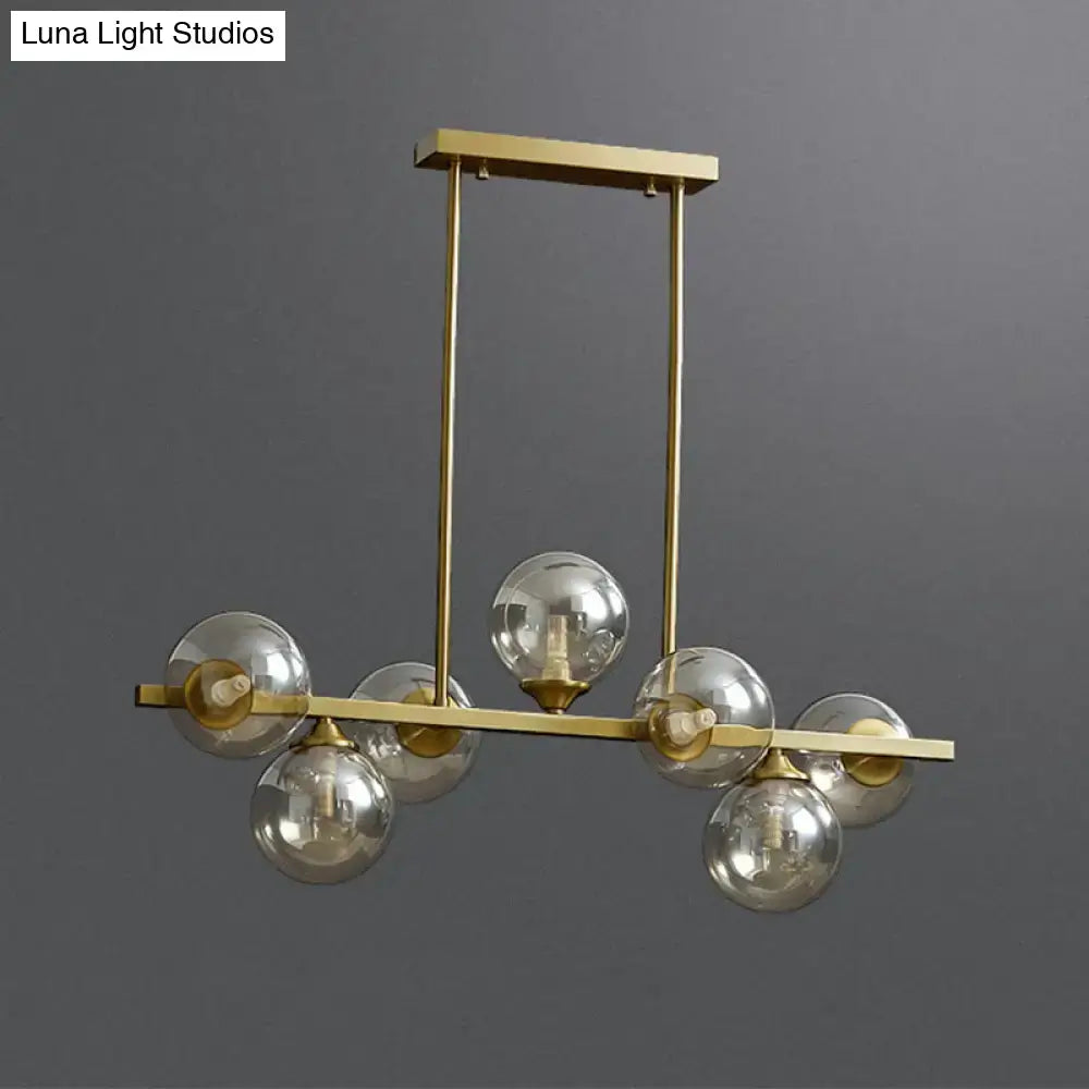 Modern gold metal amber glass island light for dining room