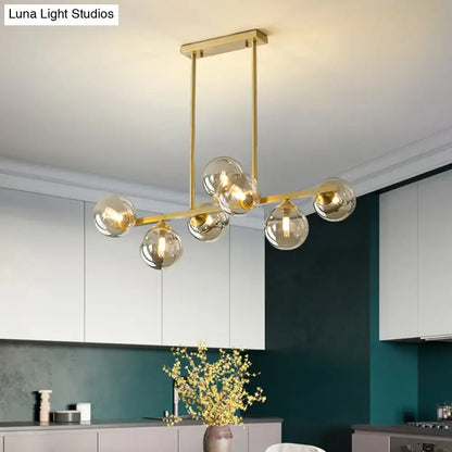 Modern gold metal amber glass island light for dining room