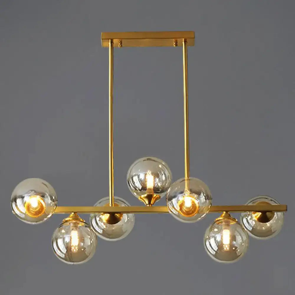 Modern gold metal amber glass island light for dining room