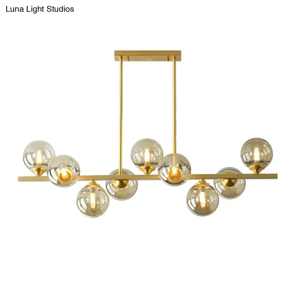 Modern gold metal amber glass island light for dining room