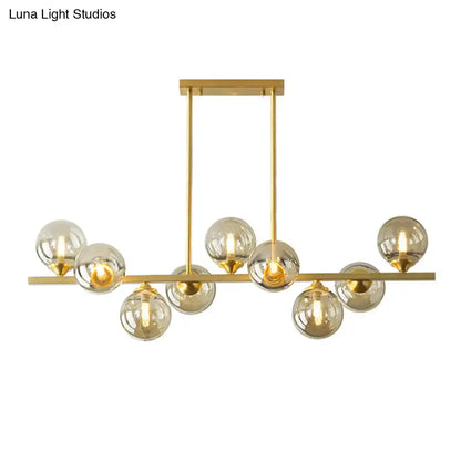 Modern gold metal amber glass island light for dining room