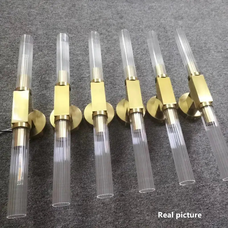 Modern gold metal and glass wall sconce light for bathroom