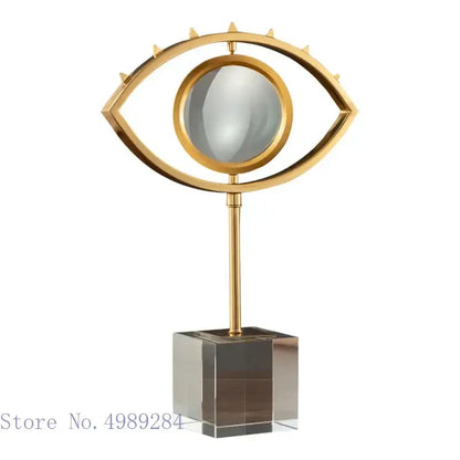 Modern gold metal eye magnifying glass with glass base living room decor