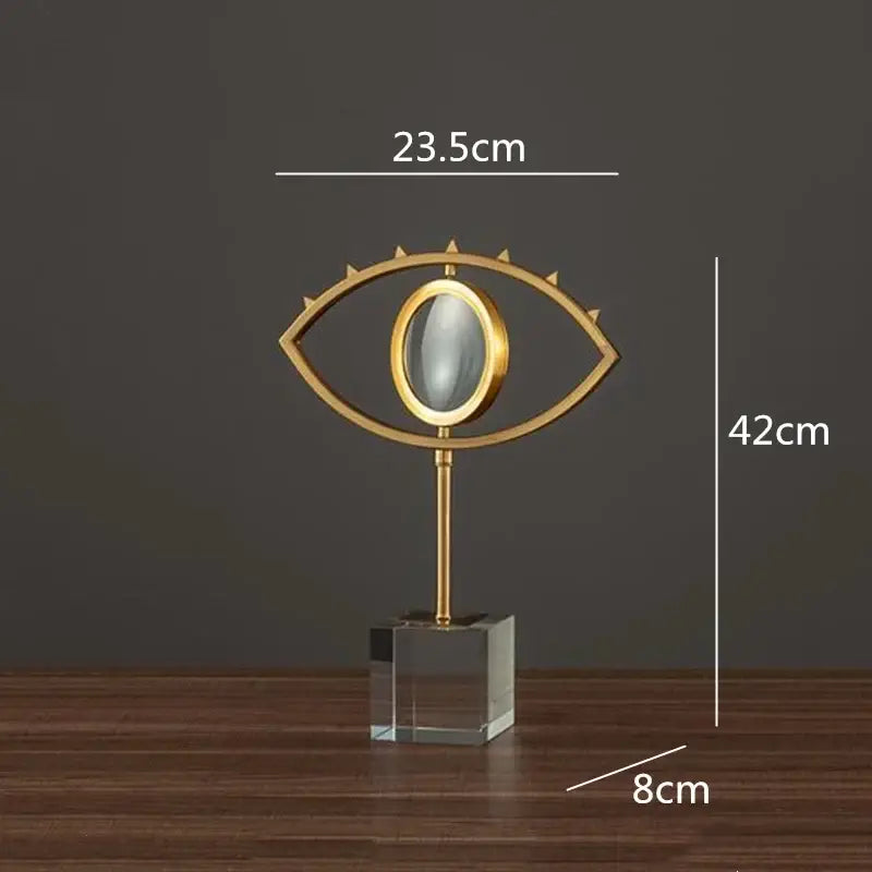 Modern gold metal eye magnifying glass with glass base living room decor