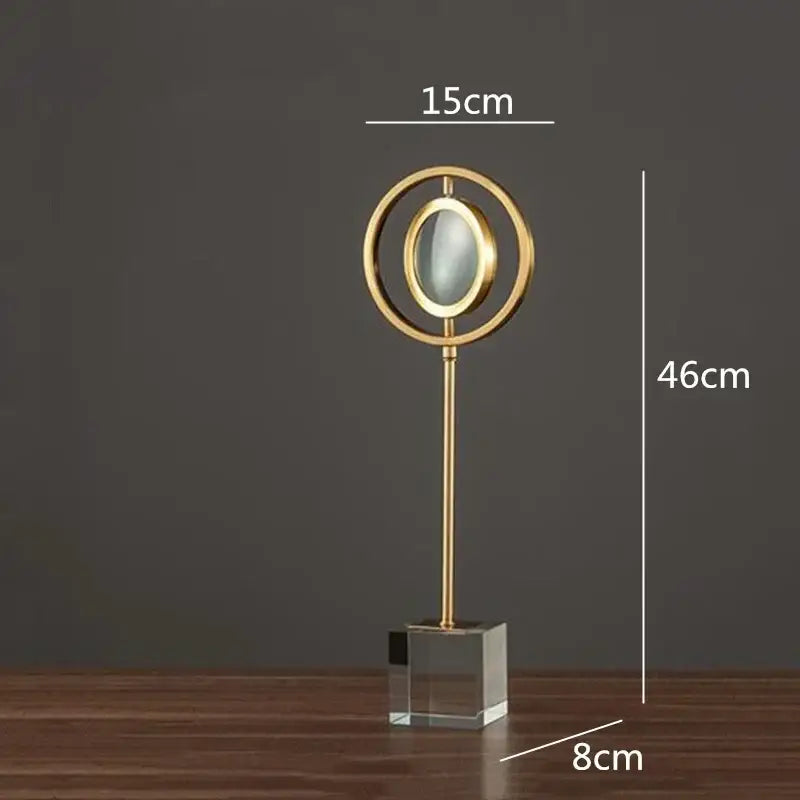 Modern gold metal eye magnifying glass with glass base living room decor