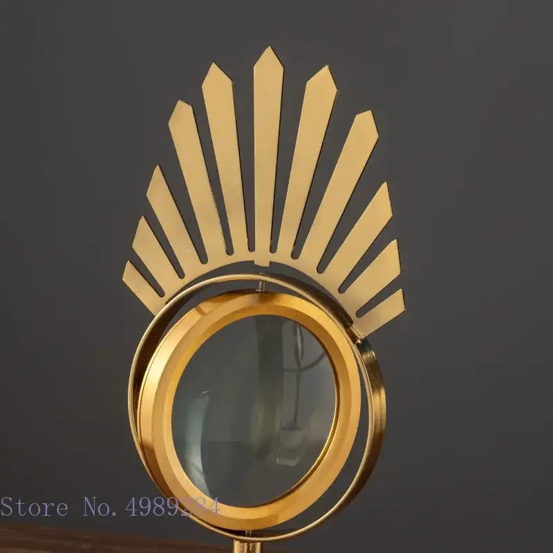 Modern gold metal eye magnifying glass with glass base living room decor