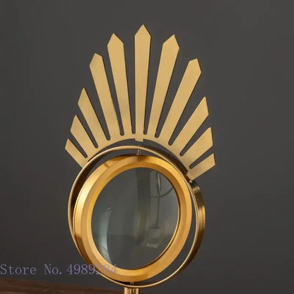 Modern gold metal eye magnifying glass with glass base living room decor