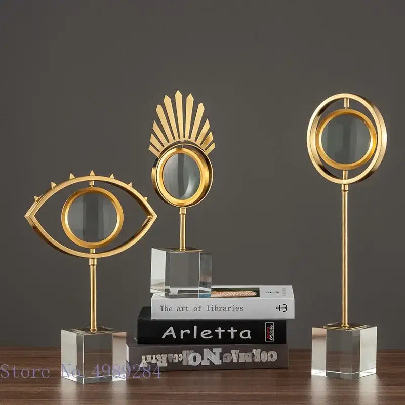 Modern gold metal eye magnifying glass with glass base living room decor