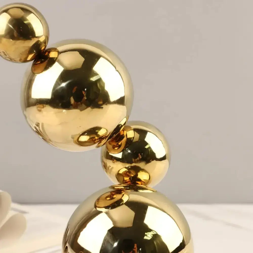 Modern gold metal spheres stacked art pieces living room decor