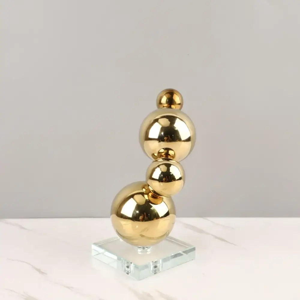 Modern gold metal spheres stacked art pieces living room decor