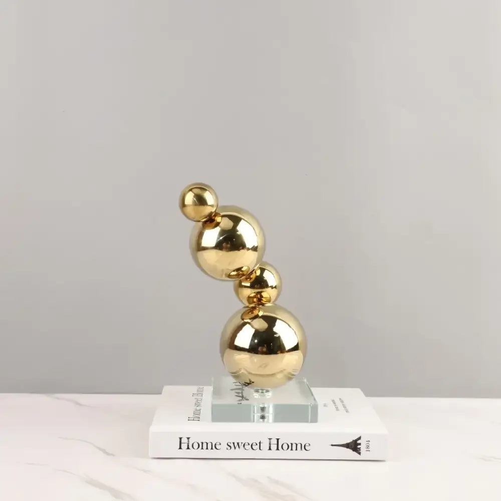 Modern gold metal spheres stacked art pieces living room decor