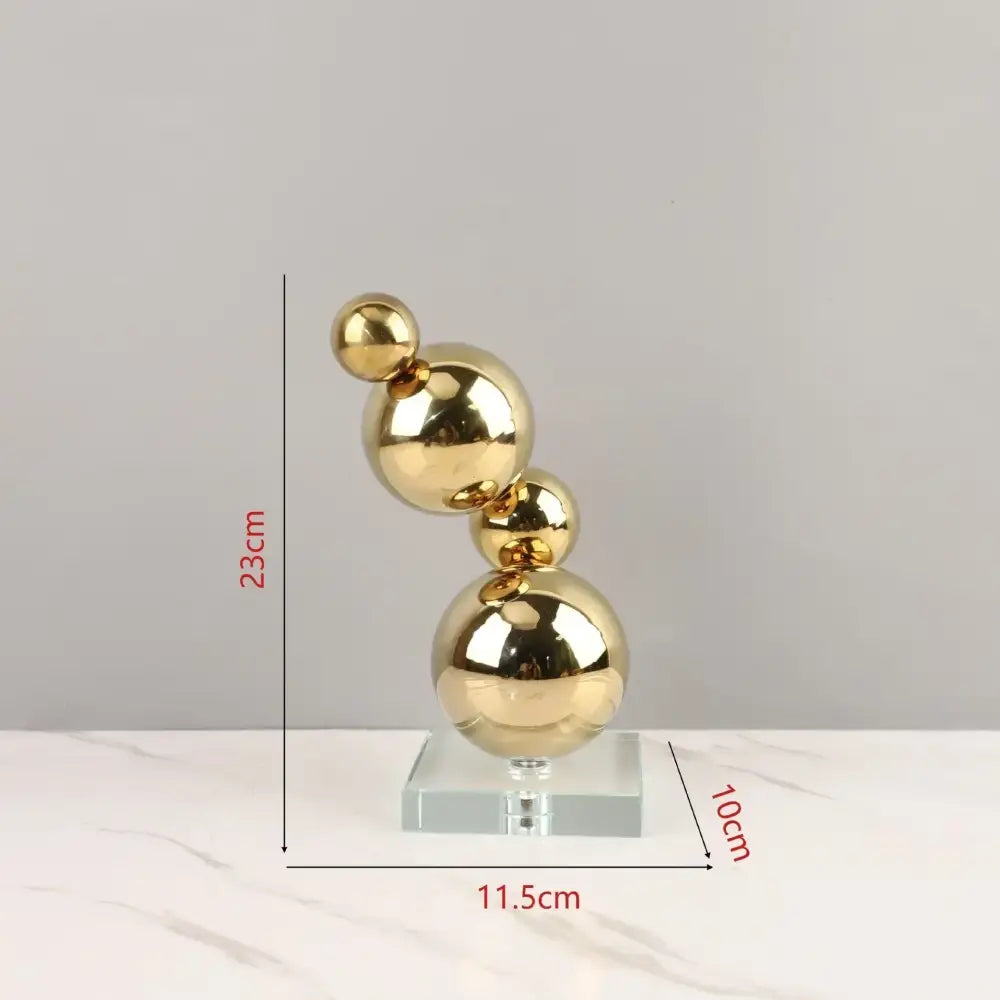 Modern gold metal spheres stacked art pieces living room decor