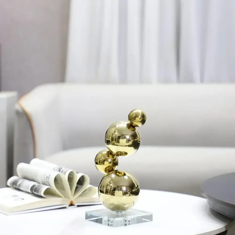 Modern gold metal spheres stacked art pieces living room decor