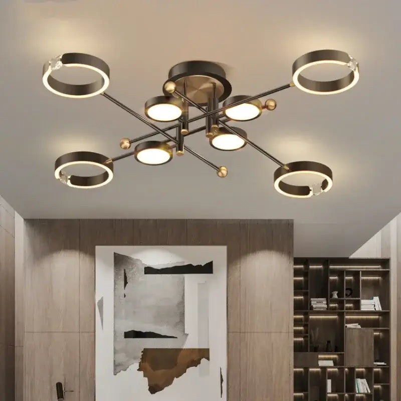 Modern gold plated chandelier with black arms for living room