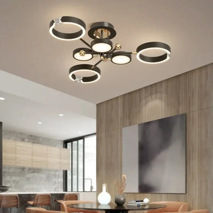 Modern gold plated chandelier with black arms for living room
