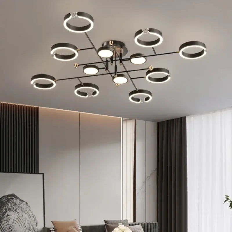 Modern gold plated chandelier with black arms for living room