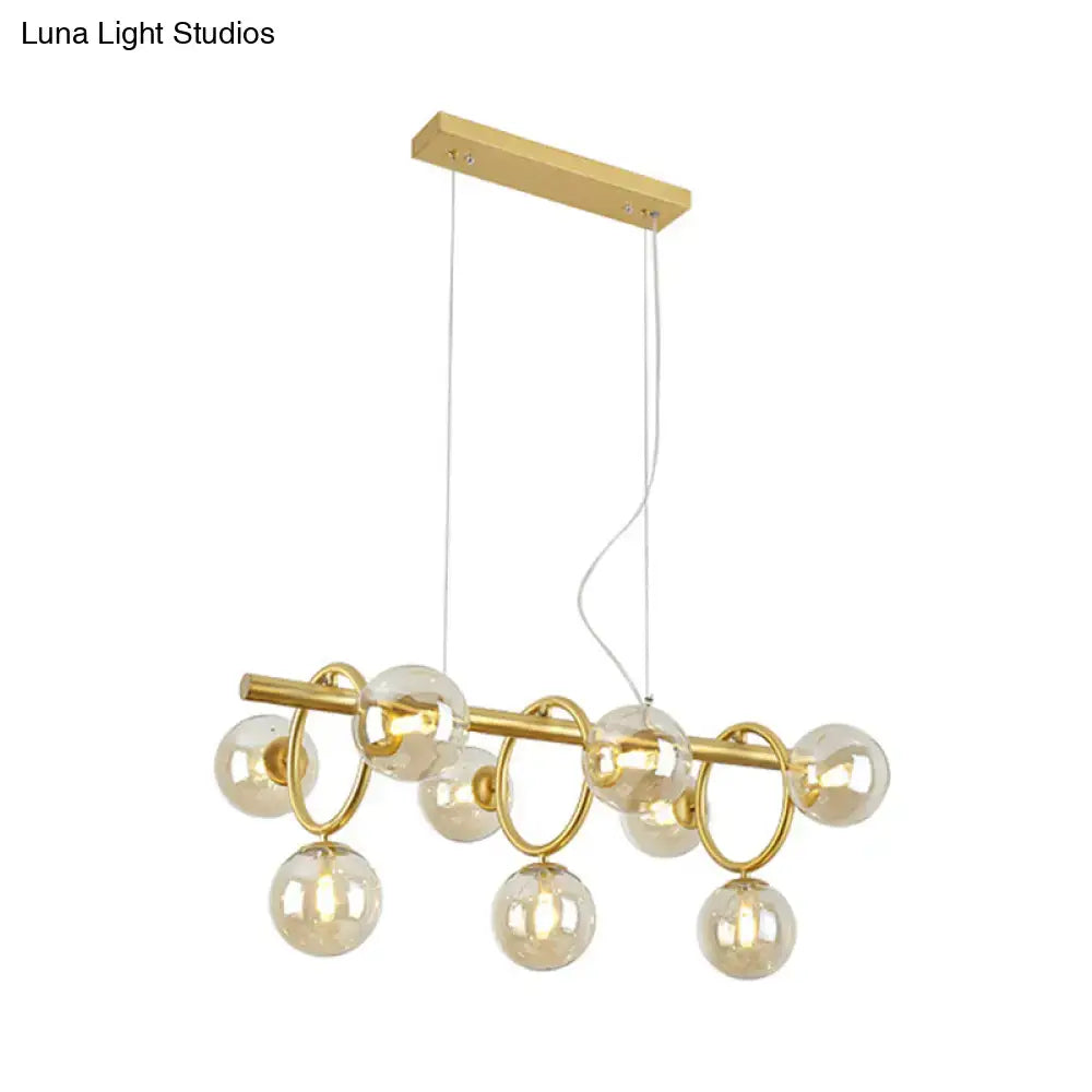 Modern gold round pendant dining room cognac glass linear design