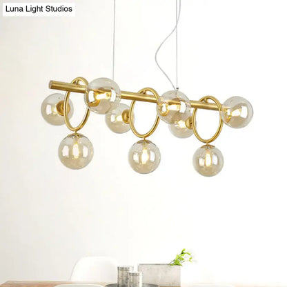 Modern gold round pendant dining room cognac glass linear design