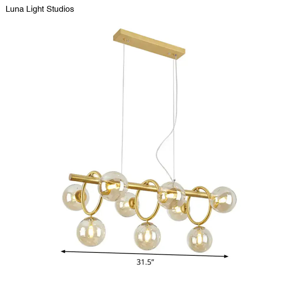Modern gold round pendant dining room cognac glass linear design
