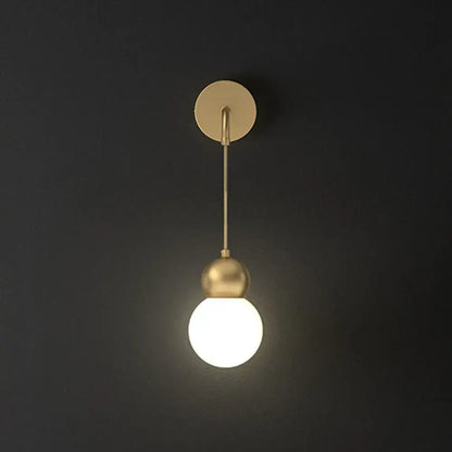 Modern gold sconce light with milky glass – bedroom wall lamp