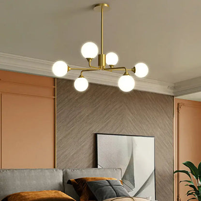 Modern gold sputnik chandelier with white glass shades living room