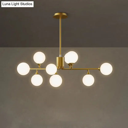Modern gold sputnik chandelier with white glass shades living room
