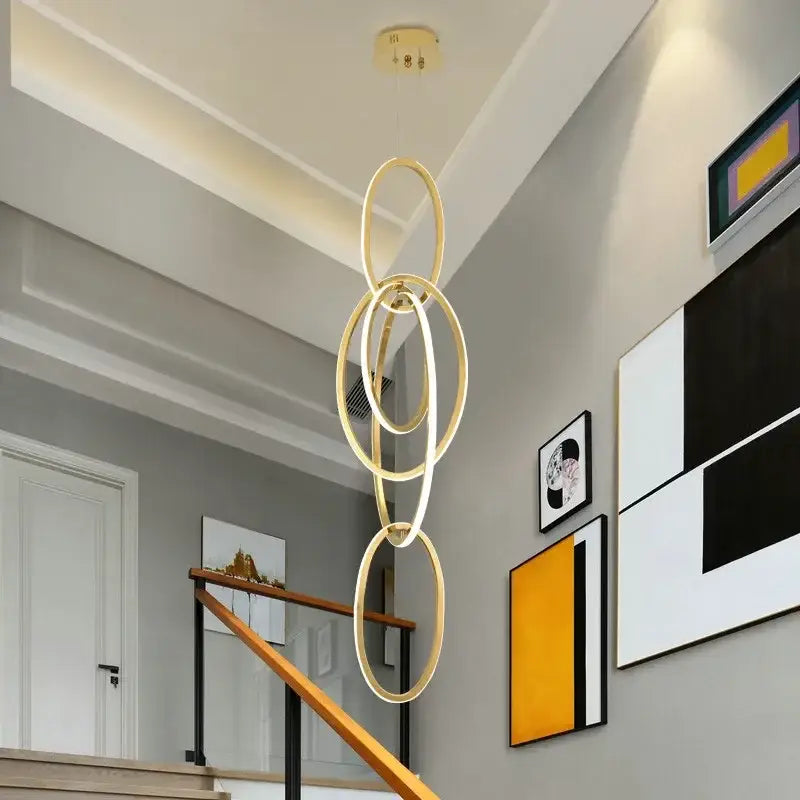 Modern gold steel pendant light interlocking rings dining room
