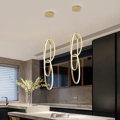 Modern gold steel pendant light interlocking rings dining room