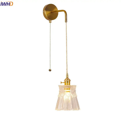 Modern gold wall lamp with clear glass shade – bedroom pull chain