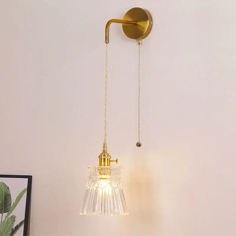 Modern gold wall lamp with clear glass shade – bedroom pull chain