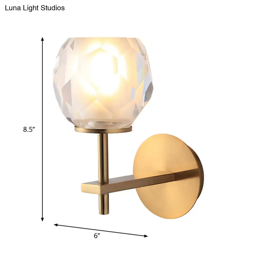 Modern gold wall lamp with faceted globe shade for hallway