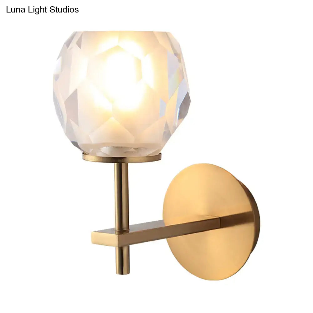 Modern gold wall lamp with faceted globe shade for hallway