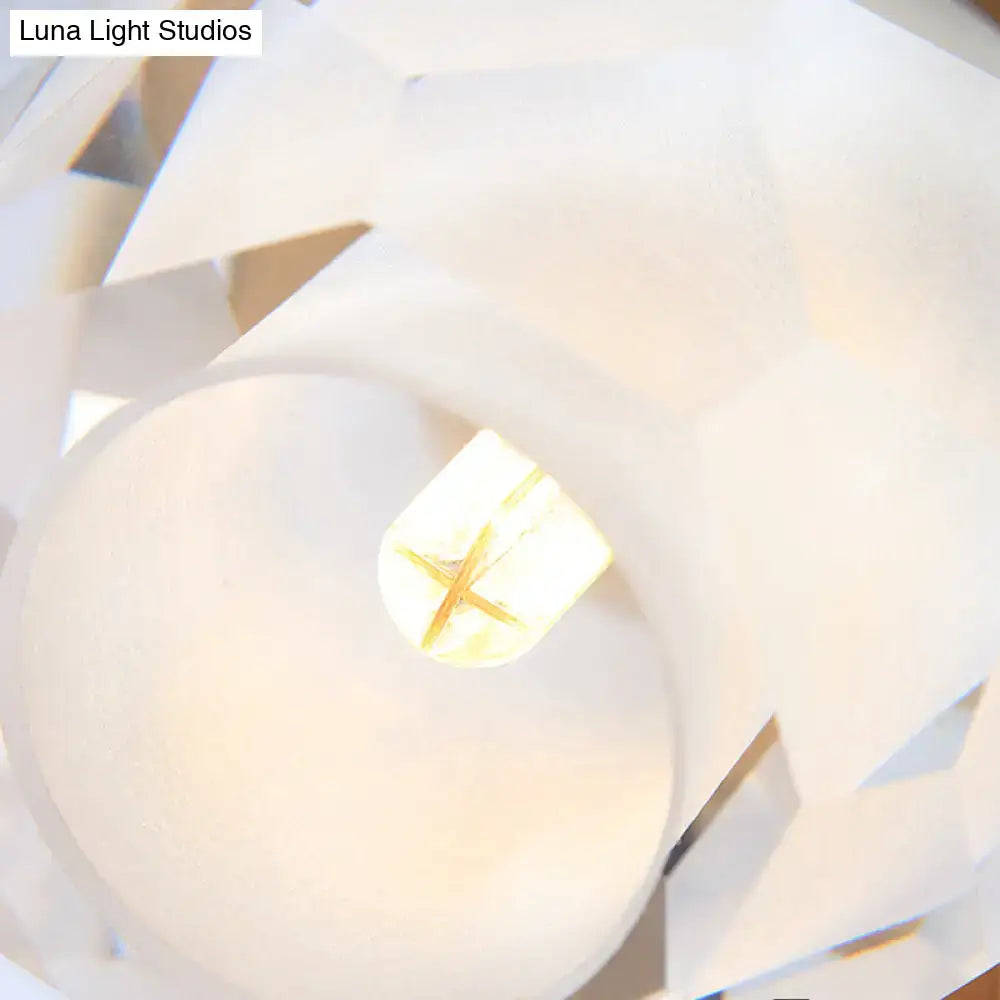 Modern gold wall lamp with faceted globe shade for hallway
