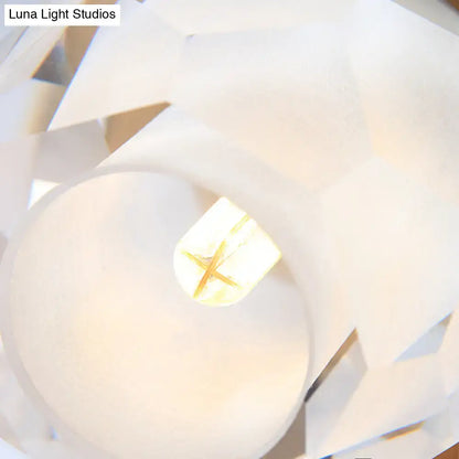 Modern gold wall lamp with faceted globe shade for hallway