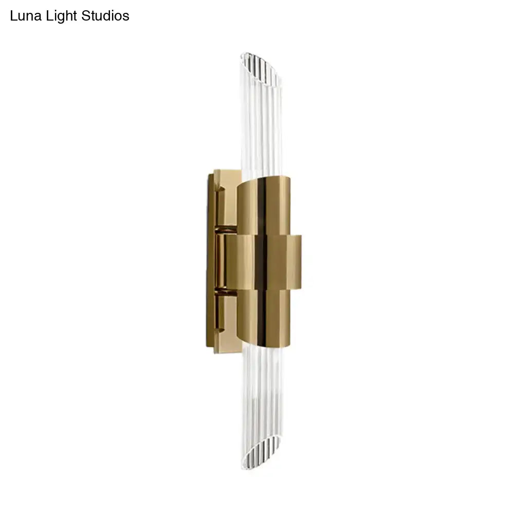 Modern gold wall lamp with prismatic crystal shade for bedroom