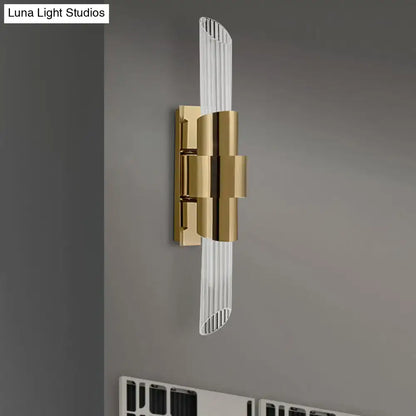 Modern gold wall lamp with prismatic crystal shade for bedroom