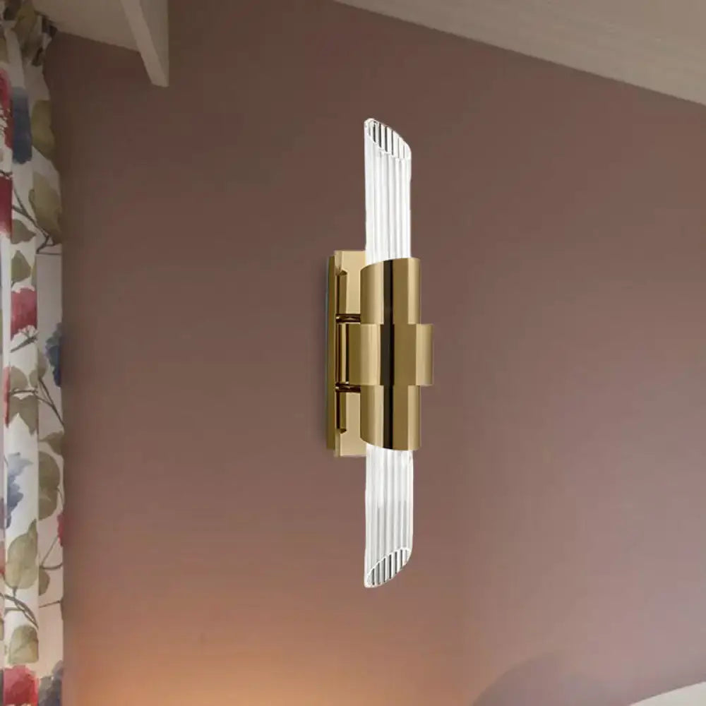 Modern gold wall lamp with prismatic crystal shade for bedroom