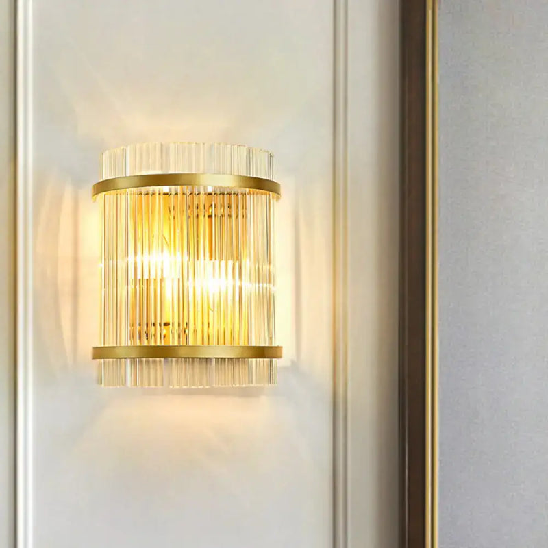Modern gold wall sconce with clear crystal rods for hallways