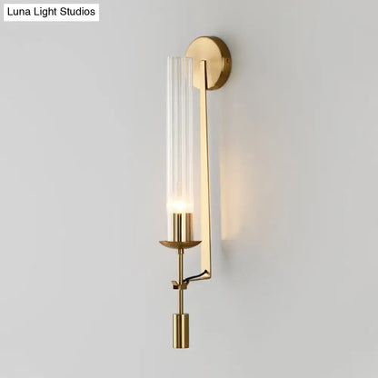 Modern gold wall sconce with clear glass shade bathroom light