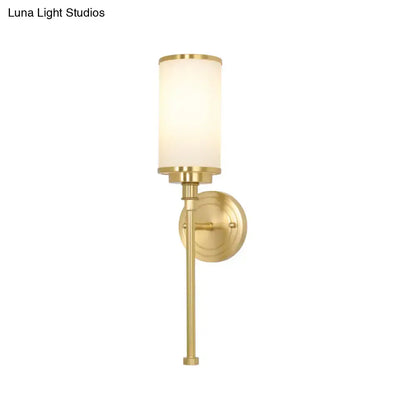Modern gold wall sconce with milky glass shade for living room
