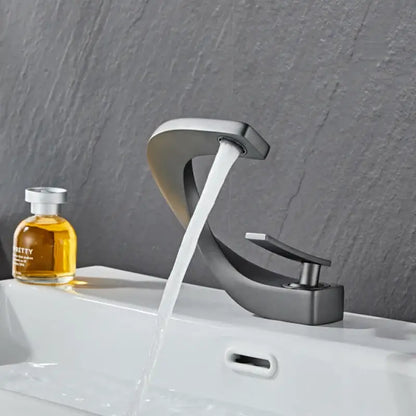 Modern gold & white bathroom basin faucet with curved spout