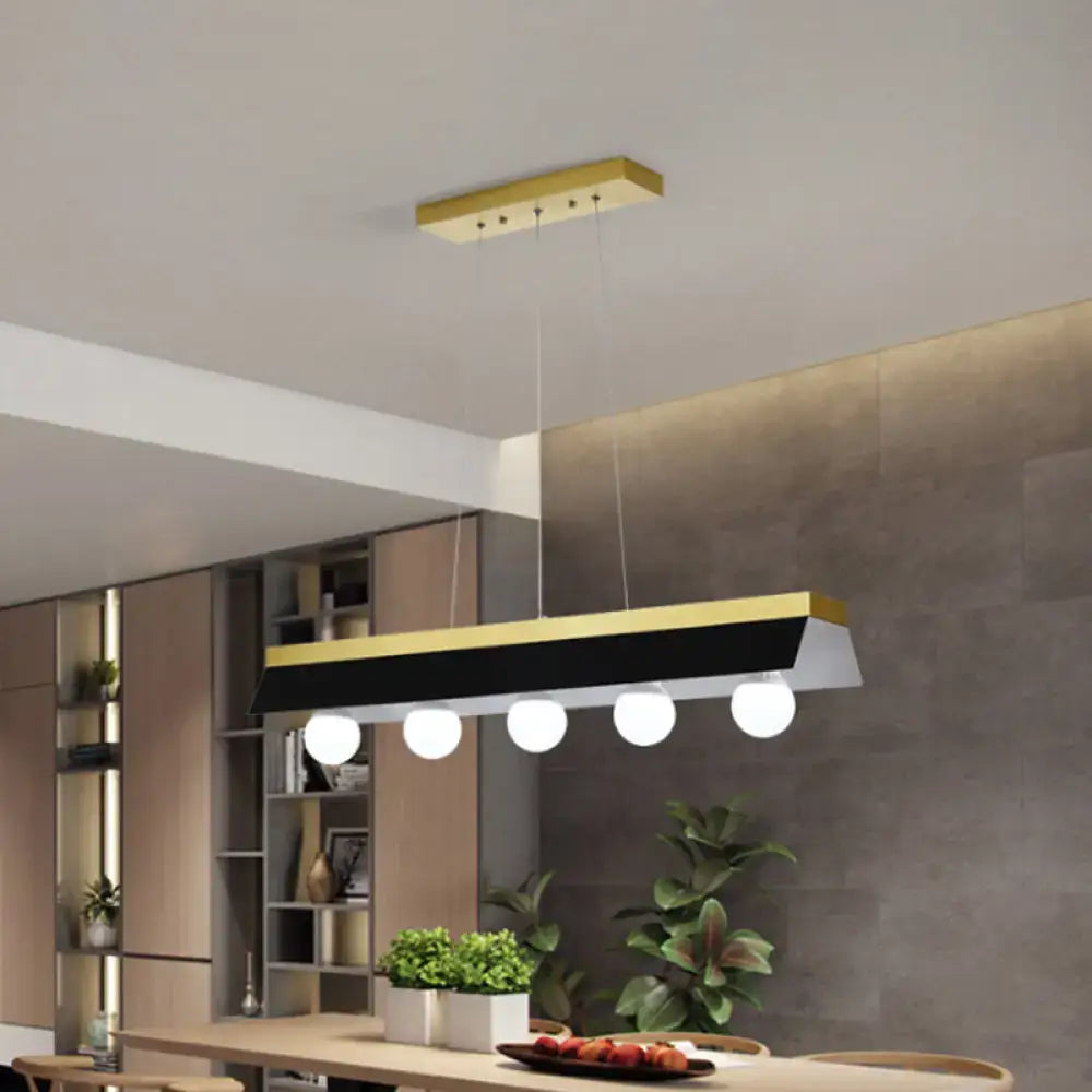 Modern gold & wood pendant light with black & white shade dining room